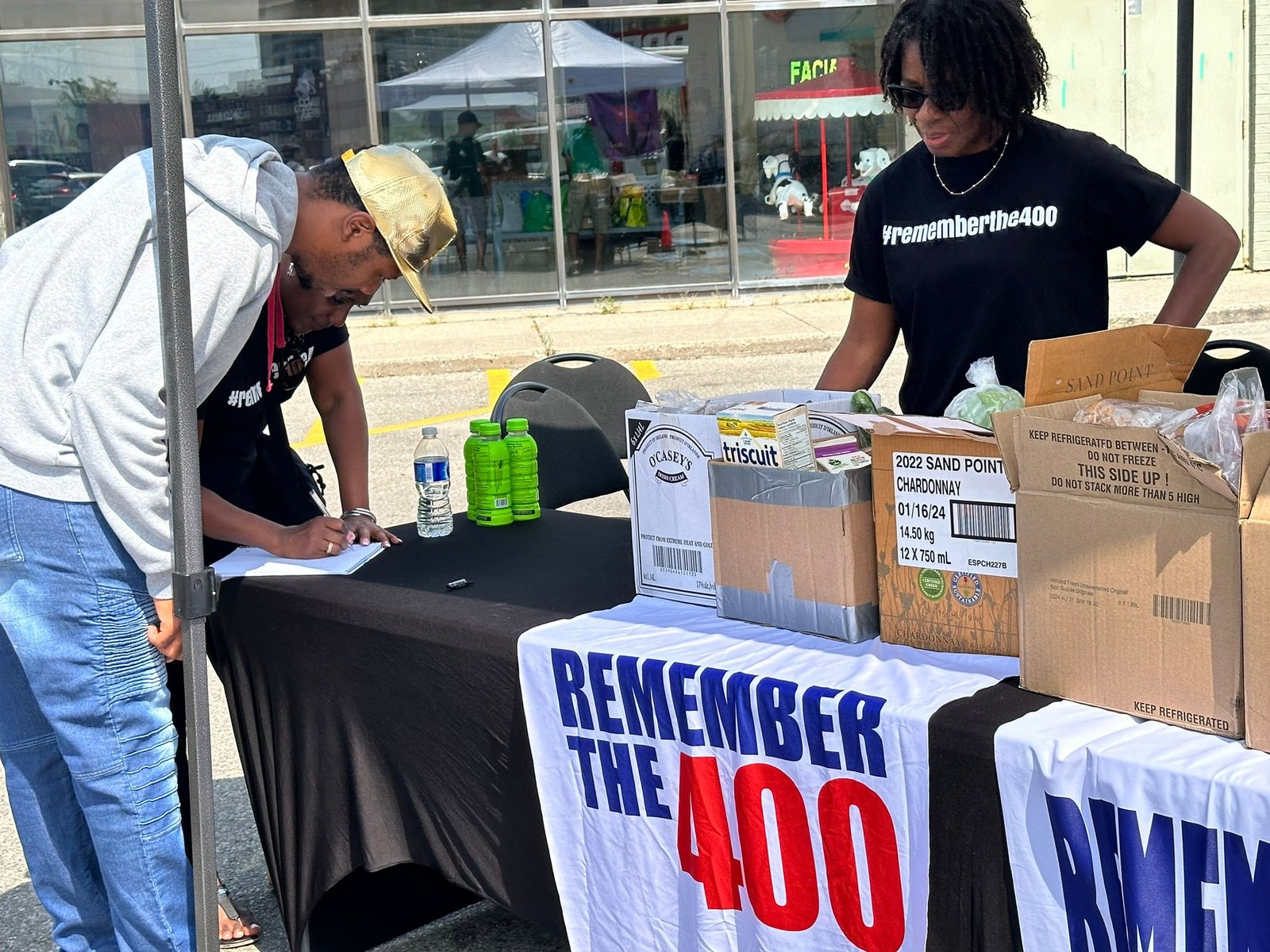 Volunteers at a Remember The 400 food giveaway