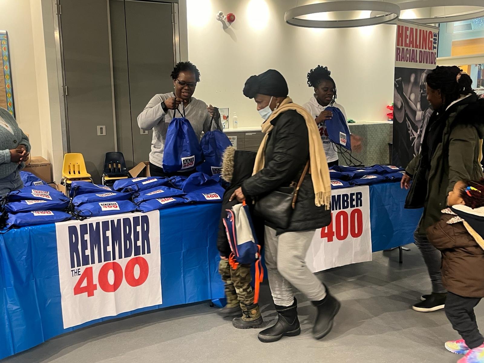 Families receiving support at a Remember The 400 distribution