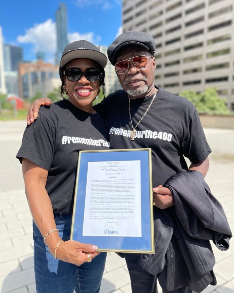 Remember The 400 members holding a civic proclamation