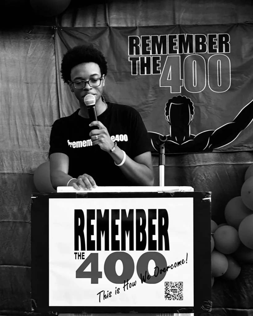Speaker at the Remember The 400 podium