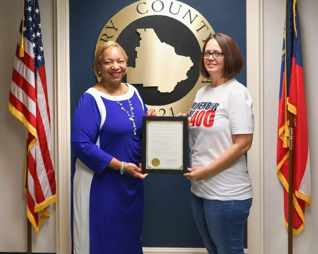 Remember The 400 representative receiving civic recognition