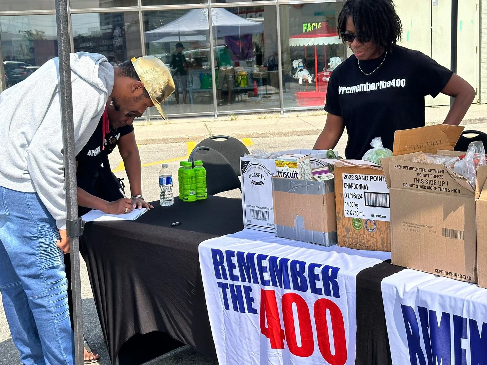 Volunteers at a Remember The 400 food giveaway