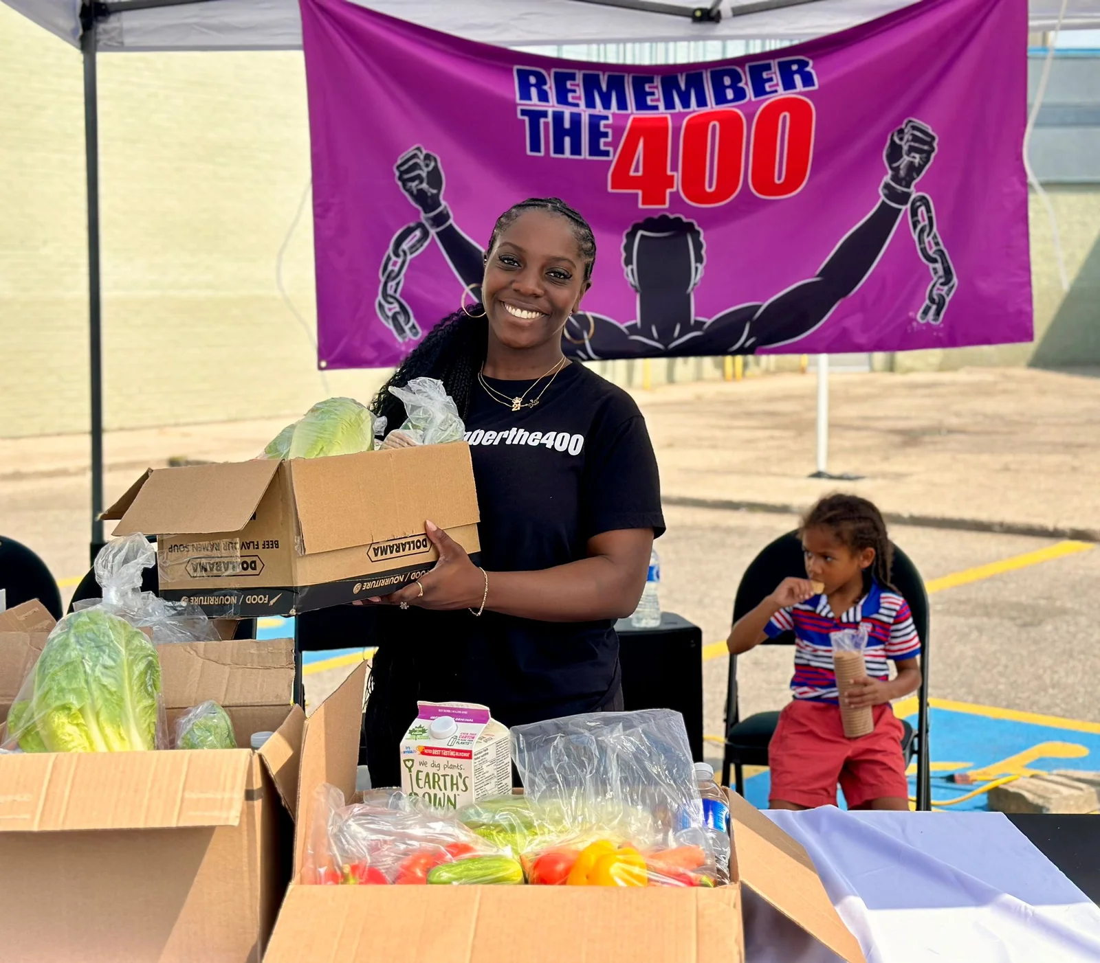 The Remember The 400 flag displayed at a food giveaway
