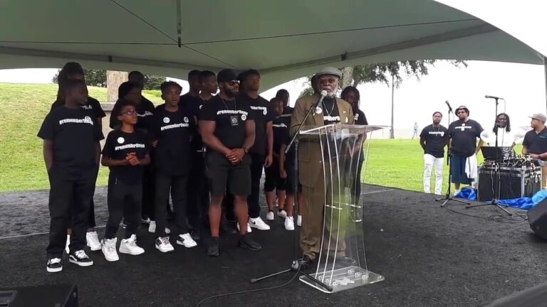 Elder Shadrock Porter speaking at the podium in Virginia, 2019
